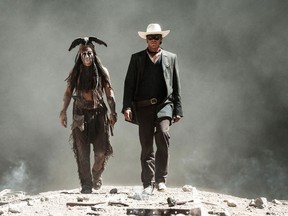 This undated publicity photo released by Disney and Jerry Bruckheimer, Inc. shows Johnny Depp, left, as Tonto, and Armie Hammer, as The Lone Ranger, in a scene from the film, "The Lone Ranger." The movie releases July 3, 2013. (AP Photo/Disney/Jerry Bruckheimer, Inc., Peter Mountain, File)