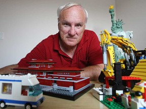 John St-Onge, 63, pictured at his home in Windsor, Ont., Tuesday, July 9, 2013, with a selection of his Lego collection, was turned away from the Vaughan Mills' Legoland on Saturday because he was not accompanying a child. (DAX MELMER for National Post)