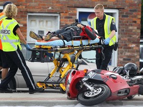 A motorcyclist was injured after crashing his bike Wednesday, July 10, 2013, in the 4600 block of Walker Road in Windsor, Ont. The accident occurred at approximately 11:30 a.m. and no other vehicles were involved. (DAN JANISSE/The Windsor Star)