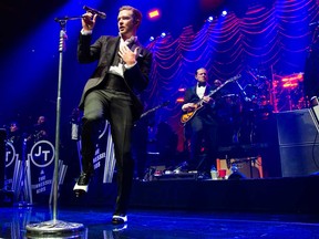 This May 5, 2013 file photo shows Justin Timberlake performing at the MasterCard Priceless Premieres concert in New York. MTV announced Wednesday, July 17, 2013, that Timberlake and Macklemore & Ryan Lewis have six MTV Video Music Award nominations each. Bruno Mars has four nominations. (Photo by Charles Sykes/Invision/AP, File)