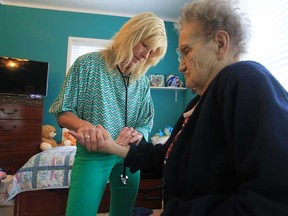 Nurse practitioner Shelley Raymond with patient Mae Christiansen in Essex, Ont. (JASON KRYK/The Windsor Star)