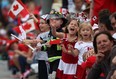 Kids cheer on the parade participants at the 2013 Canada Day Parade in Windsor, Ont., Monday, July 1, 2013.  (DAX MELMER/The Windsor Star)