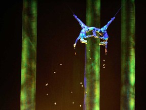 In this Nov. 28, 2008, photo, Sarah Guyard-Guillot, left, and Sami Tiaumassi perform as "Forest People" during Cirque du Soleil's "Ka" at MGM Grand Resort in Las Vegas. Guyard-Guillot, a mother of two young children, was pronounced dead at a hospital late Saturday night, June 29, 2013, after falling about 50 feet from the show's stage during a performance of Cirque du Soleil's "Ka." (AP Photo/Las Vegas Sun, Leila Navidi)