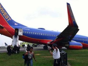 A Southwest Airlines flight lost its front landing gear after safely touching down at LaGuardia airport in New York on Monday, July 22, 2013. (Screengrab , Twitter.com via @KTAR923)