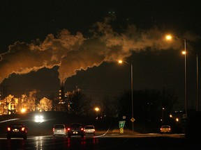 In this file photo, cars travel along E.C. Row west near Matchette Rd. as the Zug Island towers glow in the background. (Dan Janisse/The Windsor Star)