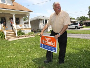 Percy Hatfield, NDP candidate for the upcoming provincial byelection in the riding of Windsor-Tecumseh was busy Wednesday, July 3, 2013, hitting the streets. He was knocking on doors and putting up campaign signs. He is shown on Balfour Boulevard in the city's east side. (DAN JANISSE/The Windsor Star)