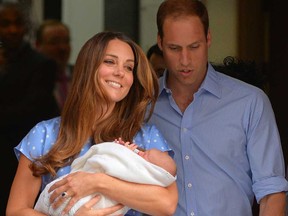 Prince William and Catherine, Duchess of Cambridge show their newborn boy to the world's media on the steps outside the Lindo Wing of St. Mary's Hospital in London on July 23, 2013. The baby was born on Monday afternoon weighing eight pounds six ounces (3.8 kilograms). The baby, titled His Royal Highness, Prince (name) of Cambridge, is directly in line to inherit the throne after Charles, Queen Elizabeth II's eldest son and heir, and his eldest son William.   (AFP PHOTO / LEON NEAL)