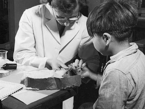 A nurse takes a blood sample from a boy at the Indian School, Port Alberni, B.C., in 1948. (The Canadian Press files)