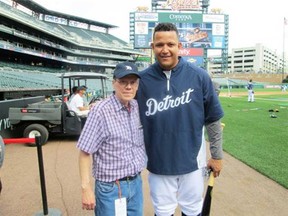 Former Gazette employee Tim Simpson, who is suffering from terminal cancer, got a visit to Comerica Park to see the Detroit Tigers play in June 2013. Tim is a big fan of the Detroit Tigers. Pictured here with Miguel Cabrera. (courtesy Simpson family) “He even posed for a picture, despite my repeated refusal to give him any free batting tips.”