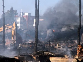 This photo provided July 8, 2013 by Surete du Quebec, shows wrecked oil tankers and debris from a runaway train that derailed and exploded in Lac-Megantic, Quebec, Canada. (AFP PHOTO/ HO / Surete du Quebec)