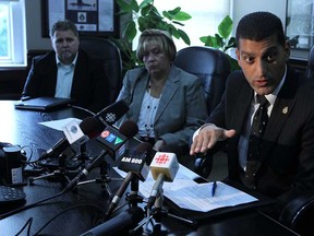 Mayor Eddie Francis, right, talks to media about the bankruptcy of the American side of the Detroit-Windsor tunnel at city hall in Windsor on Thursday, July 25, 2013.              (TYLER BROWNBRIDGE/The Windsor Star)