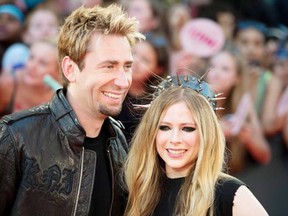 Avril Lavigne, right, and Chad Kroeger arrive on the red carpet at the Much Music Video Awards in Toronto, Sunday June 16, 2013. It has been confirmed the couple were married on Canada Day in a ceremony in the south of Francde, July 1, 2013. (Peter J. Thompson)