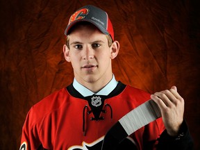 Spits defenceman Patrick Sieloff signed a contract with the Calgary Flames Friday. (Photo by Jamie Sabau/Getty Images)