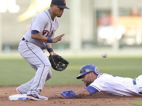 Kansas City's Alex Gordon, right, slides into second for a steal as Ramon Santiago of the Tigers fields the throw in the first inning Friday at Kauffman Stadium. (Photo by Ed Zurga/Getty Images)