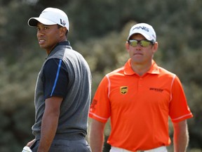 Tiger Woods, left, and Lee Westwood prepare to play the third hole during the third round of the British Open Golf Championship at Muirfield, Scotland. (AP Photo/Matt Dunham)