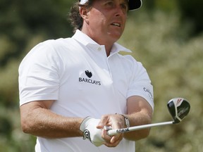 Phil Mickelson of the United States watches his drive off the third tee during the final round of the British Open Golf Championship at Muirfield, Scotland. (AP Photo/Jon Super)