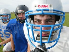 Luke Willson, from right, Greg Willson and Eric Willson take a break before a Villanova football practice in 2005. (JASON KRYK/The Windsor Star)