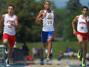 Windsor's Brandon McBride, centre, competes in the men's 400m at the 2013 Canada Summer Games Trials at Alumni Field Saturday. (DAX MELMER/The Windsor Star)