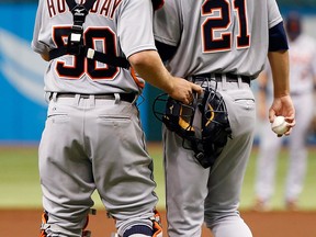 Tigers catcher Bryan Holaday, left, talks with pitcher Rick Porcello in the third inning against the Tampa Bay Rays Saturday at Tropicana Field. (Photo by J. Meric/Getty Images)