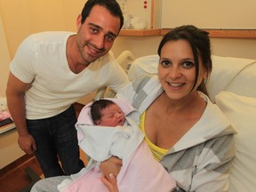Lucas and Daniela George, hold their newborn daughter Milana at Windsor Regional Hospital on July 31, 2013 in Windsor, Ontario.   (JASON KRYK /The Windsor Star)