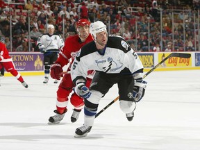 LaSalle's Andy Delmore, front, of the Tampa Bay Lightning skates after the puck against the Detroit Red Wings during a pre-season game at Joe Louis Arena on September 22, 2006 in Detroit, Michigan. (Photo by Dave Sandford/Getty Images)