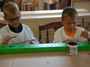 Noah Paquette, 6, and his brother Nash, 4, paint a stud destined for their new home in Amherstburg. The house is being build by Habitat for Humanity Windsor-Essex, which kicked off it’s Stud-a-Thon fundraiser Wednesday at the Habitat ReStore. Businesses and individuals can purchase a stud for a $100 donation. Sponsors are welcome to decorate or write messages on the wooden 2 x 4, which will be used to help build the Paquette’s home. Noah and Nash were there with brother Ethan, 1, and mom and dad, Melissa and Justin Paquette. Empire Communications was the first company to sponsor a stud. Julie Kotsis/The Windsor Star