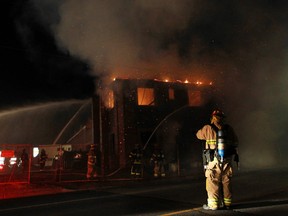 Windsor firefighters battle a blaze at the construction site of a new business plaza at Dougall Avenue and West Grand Boulevard on July 25, 2013. (Dax Melmer / The Windsor Star)