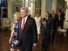 Prime Minister Stephen Harper and his wife Laureen arrive for the swearing in of the federal cabinet at Rideau Hall in Ottawa on Monday, July 15, 2013. THE CANADIAN PRESS/Patrick Doyle