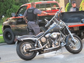 A man riding a motorcycle suffered minor injuries in a collision with a pickup truck on Thursday. The accident happened in the 3300 block of Sandwich Street around 7:10 p.m. (Monica Wolfson/The Windsor Star)