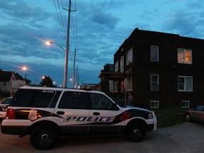 A Windsor police vehicle at the scene of a bloody altercation in front of an apartment building at 1091 Wyandotte St. West on July 26, 2013. (Dax Melmer / The Windsor Star)