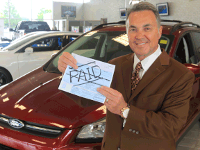 John Chisholm, of Rose City Ford, will be paying up to one per cent of a new car towards a buyer's property taxes.  (JASON KRYK/The Windsor Star)