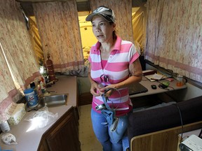 Cynthia Jamieson is photographed in the trailer she has been calling home since mold was discovered in their newly purchased home in south Windsor on Wednesday, July 24, 2013.              (TYLER BROWNBRIDGE/The Windsor Star)