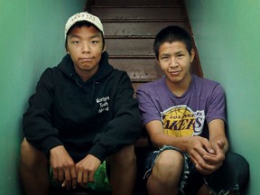 Garrett Ameralik, 17, left, and Andrew Iyerak , 16, both from the territory of Nunavut, are pictured in the home of their host family, Sunday, July 21, 2013.  The two boys are staying with a host family through Northern Youth Abroad.  (DAX MELMER/The Windsor Star)