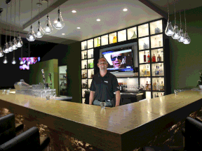 The new ownership at the Rochester Place Golf Club and Campground Resort in Lakeshore has added a stylish new bar area to the restaurant. Ian France, director of business development, is shown behind the bar. (DAN JANISSE/The Windsor Star)