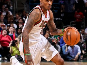 Brandon Jennings #3 of the Milwaukee Bucks advances the ball against Miami in Eastern Conference playoffs. (Gary Dineen/Getty Images)