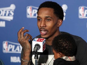 Brandon Jennings of the Milwaukee Bucks speaks during a press conference following his team's loss to the Miami Heat in Game Three of the Eastern Conference quarter-finals in 2013.
Gary Dineen/Getty Images)