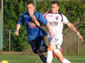 Windsor Stars midfielder Alex Rickett, left, and Kingston FC defeder Hugo Delmaire battle at Windsor Stadium on Saturday, July 13, 2013. (REBECCA WRIGHT/ The Windsor Star)