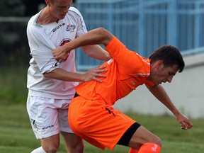 Alexander Rickett, left, oof the Windsor Stars battles Burlington's Mario Gavran during first half soccer action at Windsor Stadium Friday July 5, 2013.  (NICK BRANCACCIO/The Windsor Star)