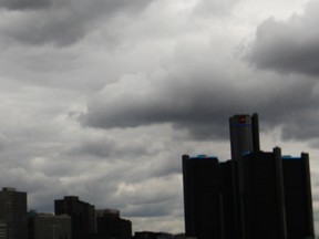 Storm clouds gather over the Detroit skyline in this 2013 file photo. (Dax Melmer / The Windsor Star)