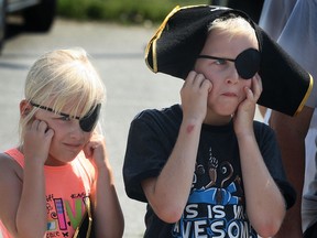 The tall ship Liana's Ransom sailed into the Kingsville harbour, Friday, July 19, 2013, to Tall Ships 1812 tour. Caden Laman, 10, and his sister McKenna Laman, 6, of Kingsville plug their ears as the cannons were fired off during a very loud demonstration. (DAN JANISSE/The Windsor Star)