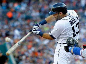 Detroit's Alex Avila hits an RBI-single to drive teammate Victor Martinez against the Texas Rangers in the first inning at Comerica Park on July 12, 2013 in Detroit, Michigan. (Photo by Duane Burleson/Getty Images)