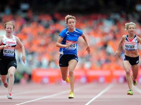 Windsor's Virginia McLachlan, left, runs to a silver medal, just behind winner Oxana Corso, centre, of Italy, and ahead of Britain's Sophia Warner in the women's  T35 100m Saturday at The Queen Elizabeth Olympic Park on July 28, 2013 in London, England.  (Jamie McDonald/Getty Images)