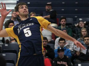 Former Lancer Kyle Williamson spikes the ball against the visiting McMaster Marauders in OUA men's volleyball at the St. Denis Centre, Saturday, Nov. 24, 2012.  (DAX MELMER/The Windsor Star)