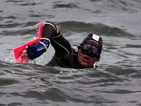 Detroit, Mich. August 6, 2013 -- Long distance swimmer Jim Dreyer passes in front of Grosse Point Yacht Club on the Michigan side of Lake St. Clair during his quest to swim across the lake Tuesday August 6, 2013. (NICK BRANCACCIO/The Windsor Star)