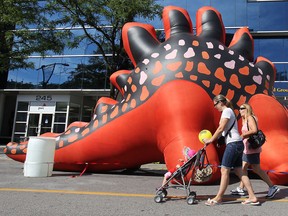 Downtown Windsor has been taken over by oversized characters. The Balloonapalooza festival was in full swing Saturday, August 17, 2013. Here people check out the event on Ouellette Avenue. (DAN JANISSE/The Windsor Star)