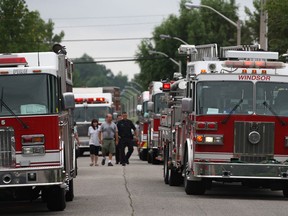 A row of Windsor firetrucks are parked on the 2400 block of St. Patricks Avenue where Windsor Fire and Rescue responded to a house fire at 2468 St. Patricks Ave., Saturday, Aug. 31, 2013.  (DAX MELMER/The Windsor Star)