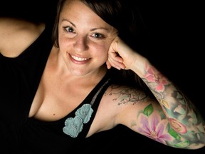 Jessica Arthur's full-sleeve tattoo includes trees, a purple clematis and a woman's face representing Mother Nature. (Wayne Cuddington , Ottawa Citizen)