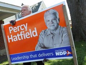 Windsor/Tecumseh by-election winner Percy Hatfield collects election signs on Friday , August 2, 2013.  (TYLER BROWNBRIDGE/The Windsor Star)