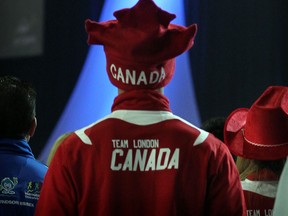 Team member from London, Ontario stands with other athletes as Canadian flag raised at International Children's Games Opening Ceremonies,   (NICK BRANCACCIO/The Windsor Star)