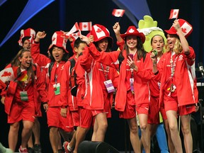 A Windsor-Essex team hits the stage during the opening ceremonies of International Children's Games at the WFCU Cenre. (NICK BRANCACCIO/The Windsor Star)